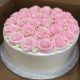 Tasty Pastry Custom Cakes: Round 1-tier cake with white icing and covered in pink icing roses