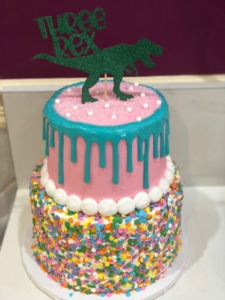 Two-tiered Sprinkles and Drip Dinosaur Birthday Cake